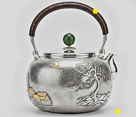 Fine silver teapot with traditional landscape relief £5450 order number 548