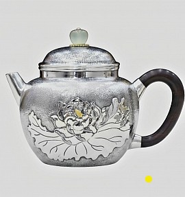Fine sterling silver handcrafted teapot with plant relief £1500 order number 880