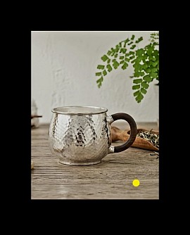 Fine sterling hammered silver mug with dark wood handle £1800 order number 880