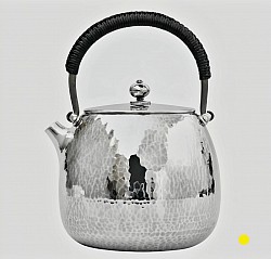 Hand-Hammered sterling silver teapot with black wrapped handle £5500 order number 880